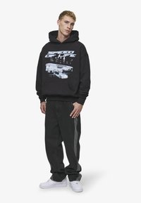 Pegador THAYER BAGGY - Jeans baggy - washed black
