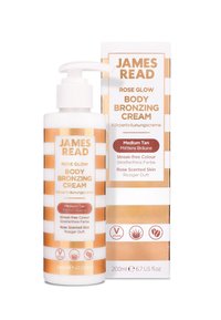 James Read Rose Glow Body Bronzing Cream in a 200ml pump bottle features a white and gold striped design with a label indicating medium tan.