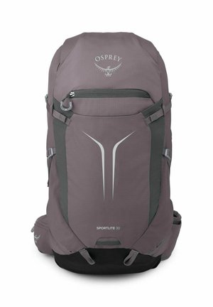 Sac à dos de randonnée violet Osprey Sportlite 30 avec poche avant zippée, sangles de compression et logo réfléchissant ainsi qu’un design sur le panneau avant.