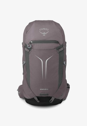 Sac à dos de randonnée violet Osprey Sportlite 30 avec poche avant zippée, sangles de compression et logo réfléchissant ainsi qu’un design sur le panneau avant.