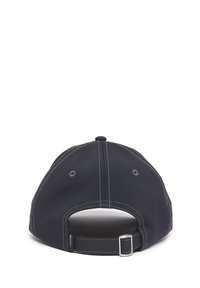 Dark blue baseball cap with a structured shape, contrast stitching, adjustable strap at the back, and ventilation eyelets.