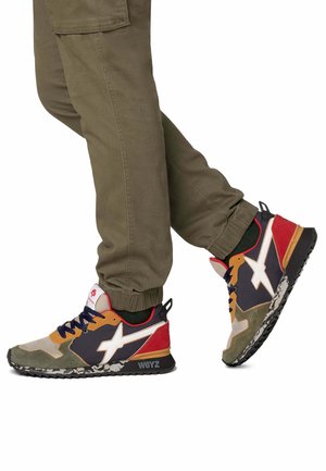 Multicolored sneaker featuring a mix of fabric and suede in olive, navy, red, and orange with prominent white star logo and textured sole.