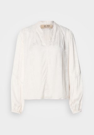 Λευκή μπλούζα με V λαιμόκοψη, μακριά φουσκωτά μανίκια και διακριτικό floral μοτίβο. Κατασκευασμένη από ελαφρύ ύφασμα με λείο, μαλακό υφή.