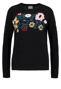 Pull noir orné d'une broderie florale colorée en nuances de rouge, rose, jaune et bleu. Texture lisse avec poignets et ourlet côtelés.