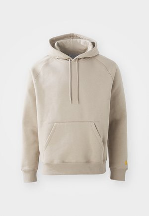 Khaki hættejakke med en stor frontlomme, ribbede manchetter og kant. Har justerbare snoretræk og en afslappet pasform. Fremstillet af blødt stof.