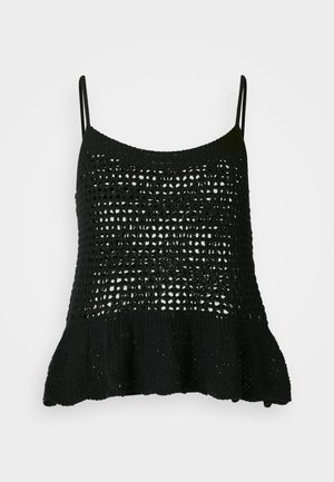 Mustast silmuskoeline tank top, millel on lahti kudumise muster, õhukesed rihmad ja põrandat puudutav äär, mis lisab kuju ja tekstuuri.