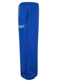 Blå joggebukser laget av bomull med elastisk midje og mansjetter. Har "New York City Basketball"-logo i hvitt og oransje.
