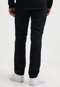 Nike SB Tygbyxor - black