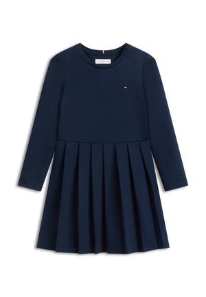 Robe bleu marine à manches longues avec jupe plissée, petit logo sur la poitrine, encolure ronde et épaules structurées.