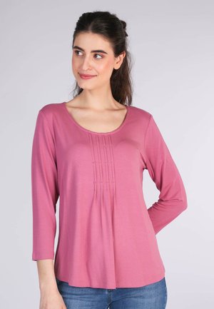 Long-sleeve pink top with round neckline, featuring pleat detailing at the front and a relaxed fit, made from soft, lightweight material.