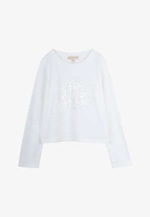 Vitt långärmat skjorta med ett cirkulärt mönster av små silverprickar och en "MK"-logotyp i mitten. Mjuk bomullstyg. Croppad design.