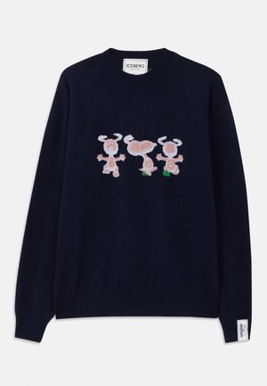 Navy blue knitted sweater featuring whimsical embroidered characters in light pink and green, with ribbed cuffs and hem, and a label at the sleeve.