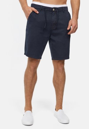 Navyblauwe shorts van stof, met zijzakken, een knoopsluiting en een broekband met trekkoord. Gladde textuur zonder patronen.