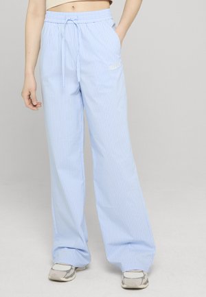 - Spodnie materiałowe