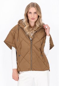 Bruine gewatteerde poncho met capuchon, een voorste rits, zijknopen en een ontspannen pasvorm. De stof is glad met een lichte glans.