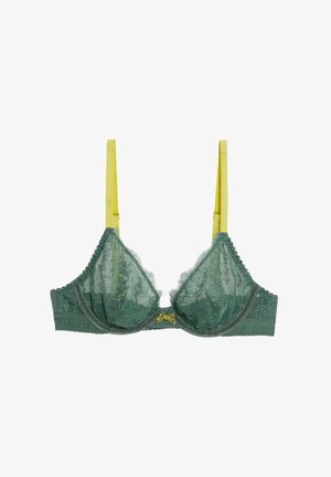 Groene kanten bh met decoratieve gele bandjes en een strikaccent in het midden. Bevat gestructureerd kant en gegolfde randen.