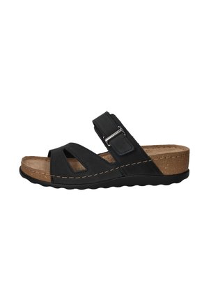 Zwarte sandaal van suede met uitgesneden ontwerp, verstelbare band en kurken zool. Heeft een ronde neus en een gestructureerde grip aan de onderkant.
