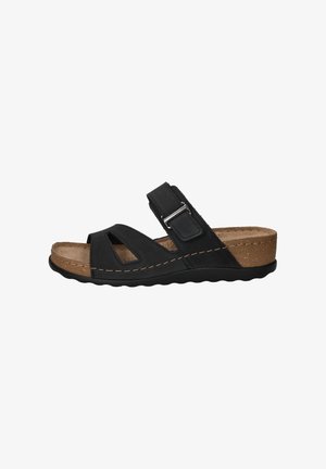 Zwarte sandaal van suede met uitgesneden ontwerp, verstelbare band en kurken zool. Heeft een ronde neus en een gestructureerde grip aan de onderkant.