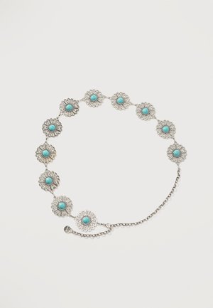 Zilveren armband met tien sierlijke ronde schakels, elk met een centrale turkoois steen en een ingewikkeld filigrainontwerp.