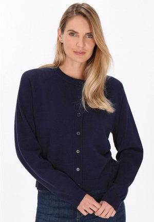 Navy blue cardigan made of soft fabric, featuring a round neck, long sleeves, and button closure down the front. Ribbed cuffs and hem.