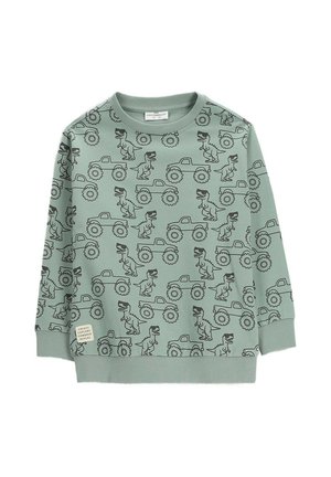 Jasnozielona dziecięca bluza z czarnym wzorem dinozaura i monster trucka, ściągaczami na rękawach i u dołu oraz małą metką materiałową.