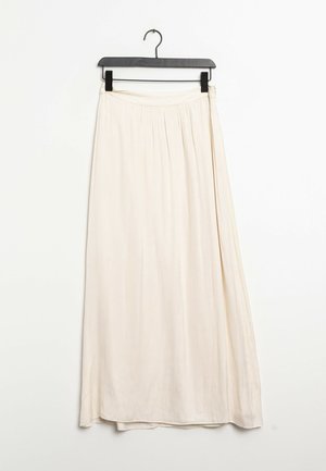Gonna lunga di colore crema realizzata in tessuto leggero, con una vita arricciata e un design fluente con un orlo dritto.