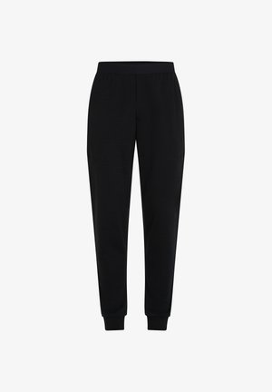 Schwarze schmal zulaufende Jogginghosen mit elastischem Bund und Beinbündchen, vor einem weißen Hintergrund präsentiert.