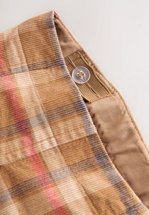 Geruit stof met bruine, rode en blauwe tinten; voorzien van een transparante knoop en een glad khakikleurig deel voor contrast.