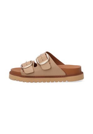 Beige leather slide sandal with two adjustable silver buckles, tan sole, and textured white bottom edge. Simple, open-toe design.