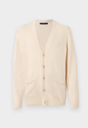 Beige strikket cardigan med lange ermer, knapper foran, to frontlommer, og ribbestrikkede mansjetter og kant.