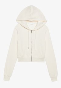 Sudadera con capucha recortada en tejido color blanco roto, con cierre de cremallera, dos bolsillos frontales, puños acanalados y una textura suave.