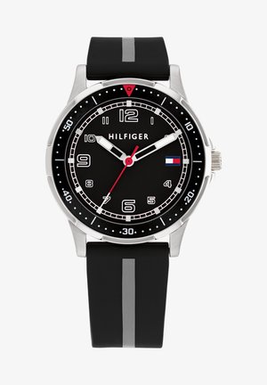 Black watch with a round metal case, black dial, contrasting white and red hour markers, and a silicone strap featuring a gray stripe.