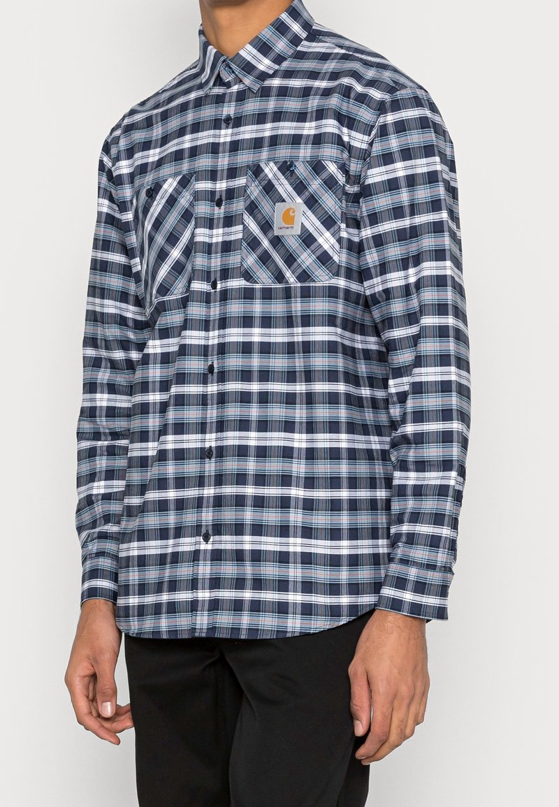 Blauwe en witte geruite overhemd met lange mouwen van katoen, met twee borstzakken, een button-down kraag en een logo patch aan de linkerkant.