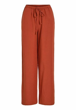 Rūdžių spalvos, plačios kelnės su elastingu juosmeniu ir priekyje rišama virvele, pagamintos iš minkštos medžiagos.