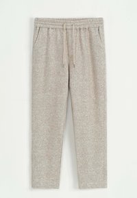 Pantalons de survêtement en molleton doux gris clair, avec une taille élastique, un cordon de serrage réglable et des poches latérales. Design à jambes fuselées.