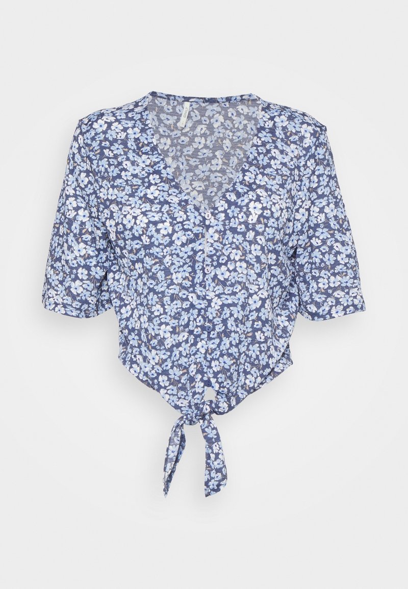 Crop top floreale blu con scollatura a V e maniche corte. Presenta una vestibilità ampia, dettaglio con lacci in vita e motivi floreali bianchi su sfondo blu.