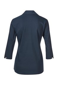 Dunkelblaue Bluse mit langen Ärmeln, Rückenpasse und geschlitzten Manschetten. Aus glattem Stoff gefertigt, verfügt sie über einen klassischen Kragen und eine figurbetonte Passform.