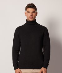 Schwarzer Rollkragenpullover aus Strickstoff, mit einer körpernahen Passform und geripptem Saum sowie Bündchen. Minimalistischer Stil ohne sichtbare Muster.
