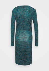 Robe moulante turquoise à manches longues avec motif léopard noir et beige vue de dos.