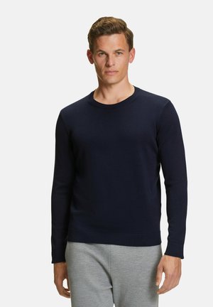 Marineblauer Strickpullover mit Rundhalsausschnitt und langenÄrmeln. Rippbündchen und Saum, glatte Textur, taillierte Form.