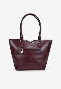 Bolso tote de cuero burdeos con borde superior en forma de ondulación, doble asa y bolsillo exterior con cremallera. Presenta herrajes en tono dorado y textura suave.