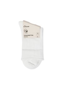 Calze in cotone biologico bianche piegate con etichetta beige che mostra il marchio Etam e i dettagli del prodotto in francese e inglese.