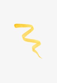 Gul teksturert bånd i en sikksakkform, med en myk, matt overflate og varierende tykkelse langs lengden mot en hvit bakgrunn.