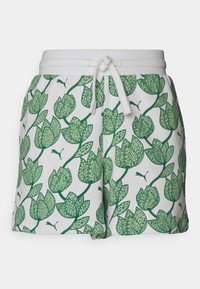 Pantalones cortos blancos con un patrón floral verde, hechos de material suave con una cinturilla elástica y cordón ajustable.