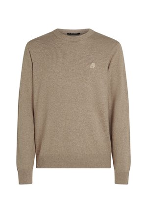 Beige crew-neck sweater lavet af blødt stof. Ribbet manchetter og kant. Har et lille logo på brystet. Enkel design, let tekstur.