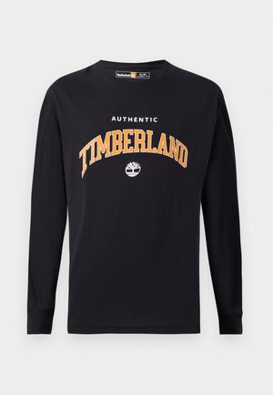 Svart långärmad t-shirt med vit och orange text samt logotyp "AUTHENTIC TIMBERLAND". Mjuk bomullsmaterial med rundad hals.