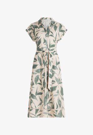 Let, kortærmet kjole med knaplukning foran og grønne bladmotiver på beige baggrund. Inkluderer et bælte til taljen og blonder på kanten.
