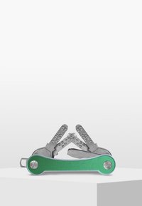 Multi-tool featuring a green aluminum body with silver metal tools. Tools have textured grips and fold out from the central handle.
