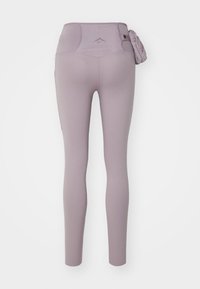 Leggings in lichtpaars, met een hoge taille, gladde textuur, voorzien van een zijzak en gestikte accenten op de tailleband.