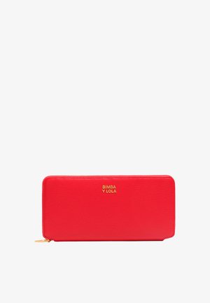 Red leather wallet with a textured surface, gold hardware, and a zip closure. Features embossed logo on the front.